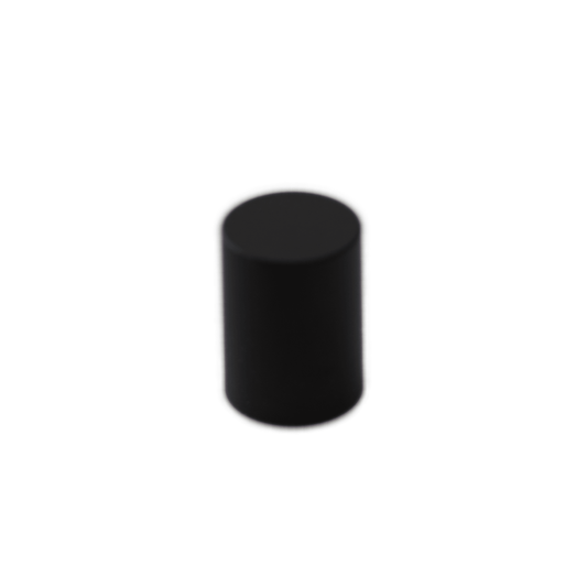 A black cylindrical object, reminiscent of the Waldorf Quantum Knob's sleek design, is positioned upright against a plain white background.