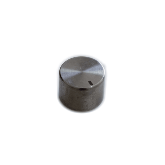 A Waldorf STVC cylindrical knob with a smooth, reflective stainless steel surface and a small horizontal indicator line on one side, placed against a plain white background.