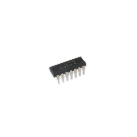 Close-up of black 14-pin integrated circuit chip for synthesizer electronics on white background