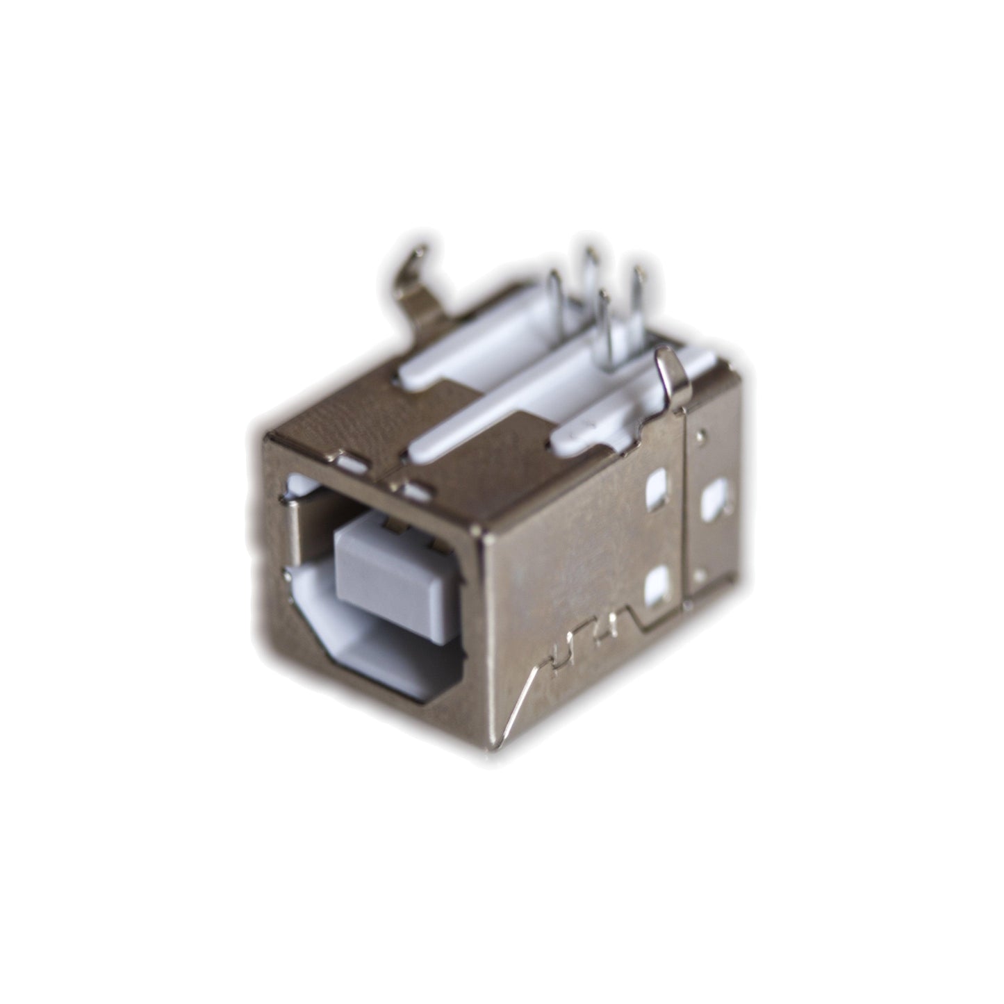 Close-up of a metal USB-B connector component isolated on white background