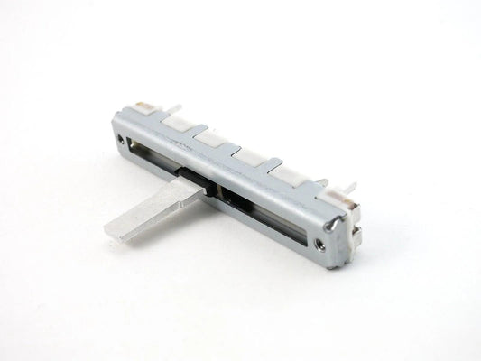 Close-up of Casio FZ-1 slide potentiometer synthesizer part on white background