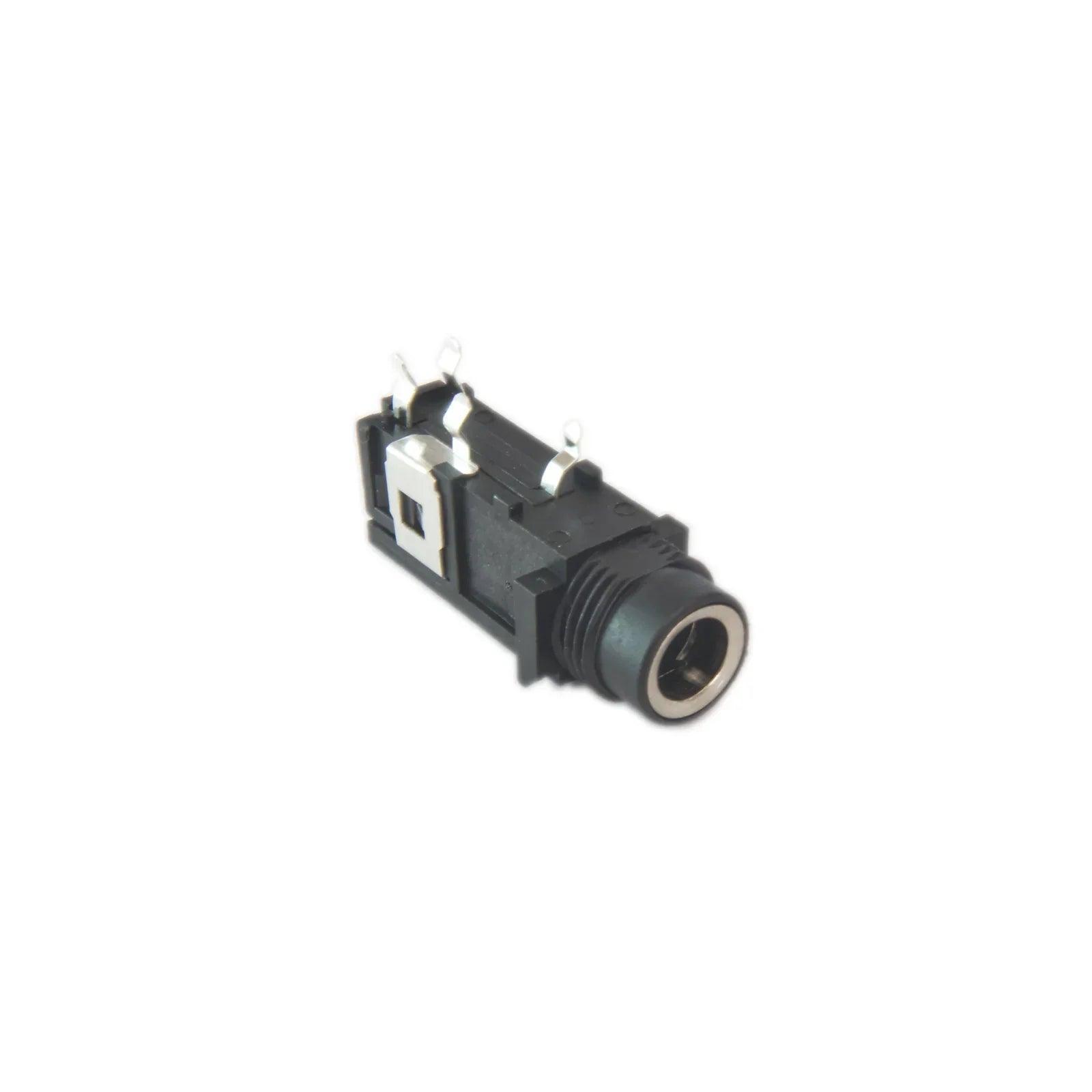 Black e-mu Command Station phone jack synthesizer part with metal connectors on white background