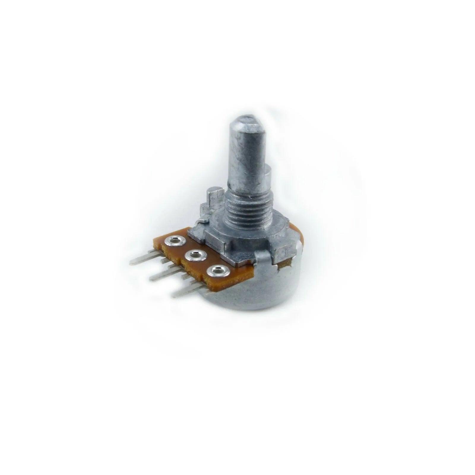 Close-up of a rotary potentiometer electronic component with metal shaft and three pin connectors