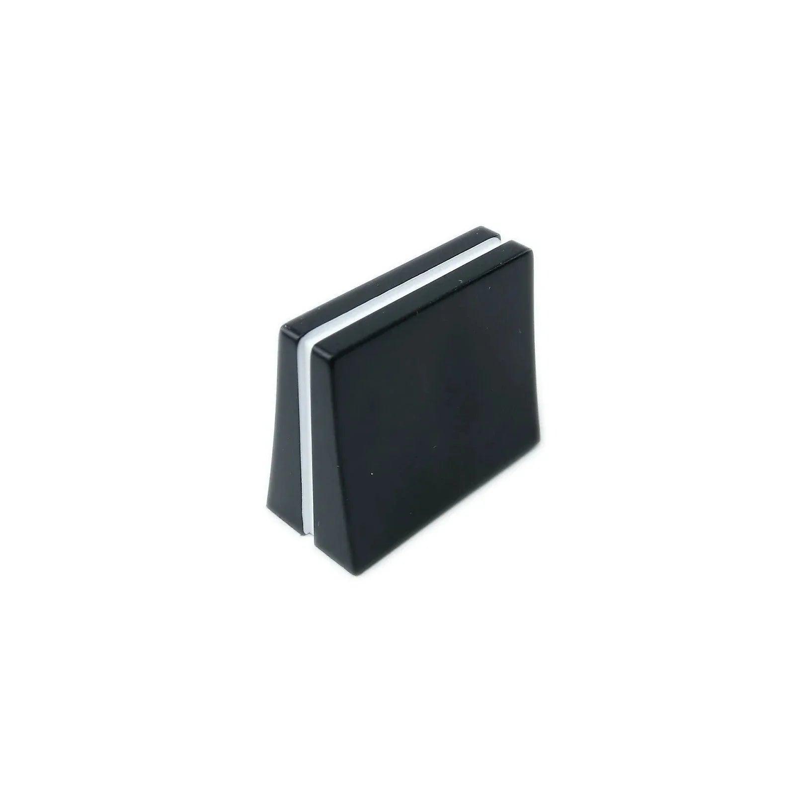 Black rectangular synthesizer slider knob with a white stripe on a white background