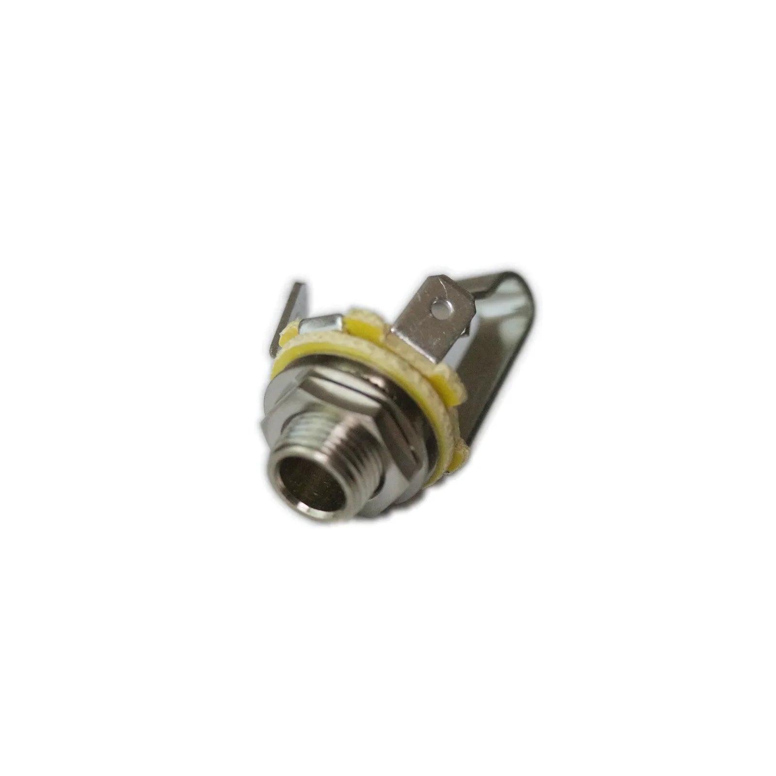 Close-up of a metal phone jack guitar input socket with mounting nut and yellow insulation ring