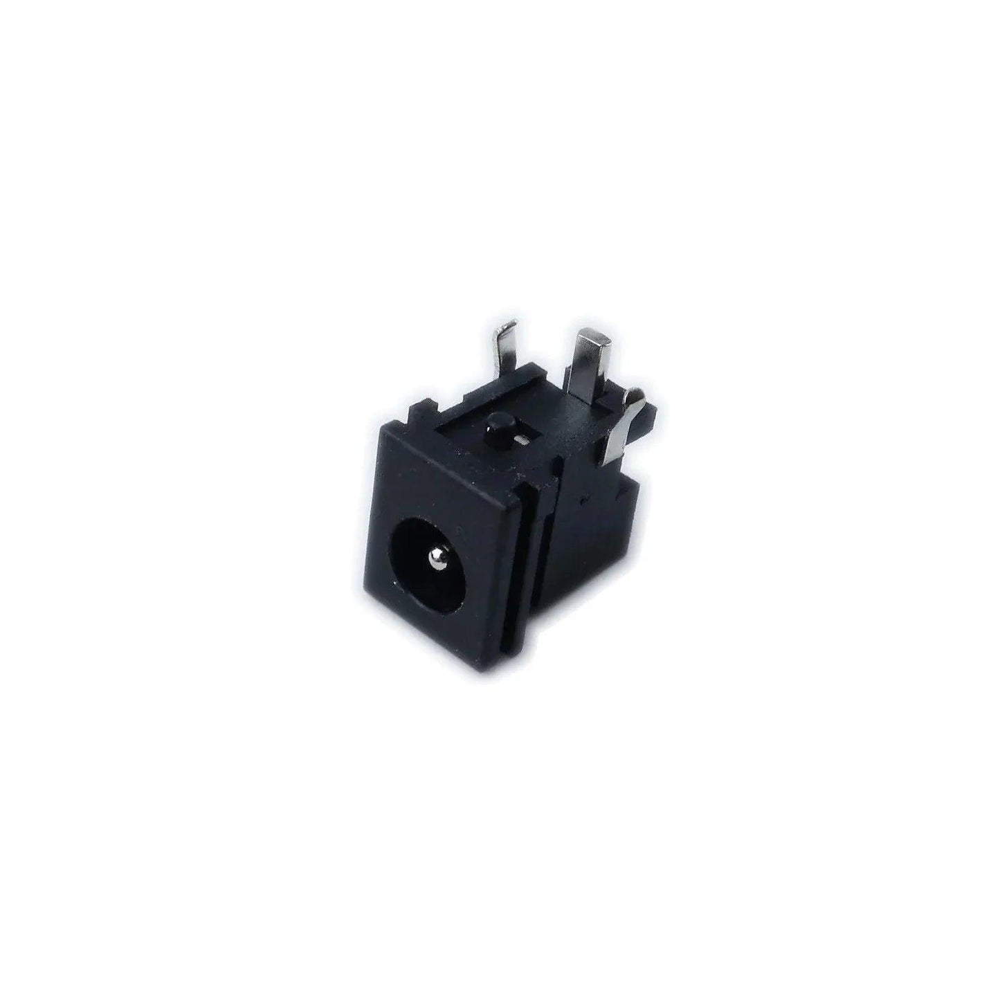 Close-up of black Korg MicroKorg XL power input jack with metal connectors on white background