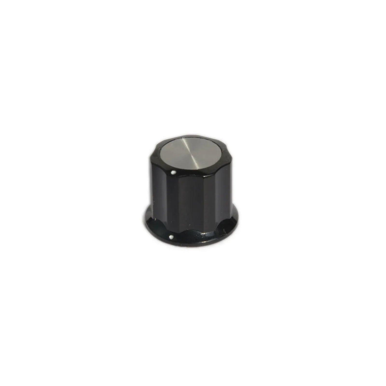 Black Moog Little Phatty synthesizer knob with silver top and dotted indicator