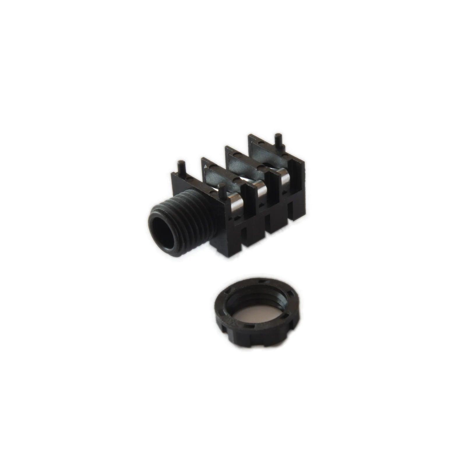 Black iridium phone jack connector with threaded ring on white background