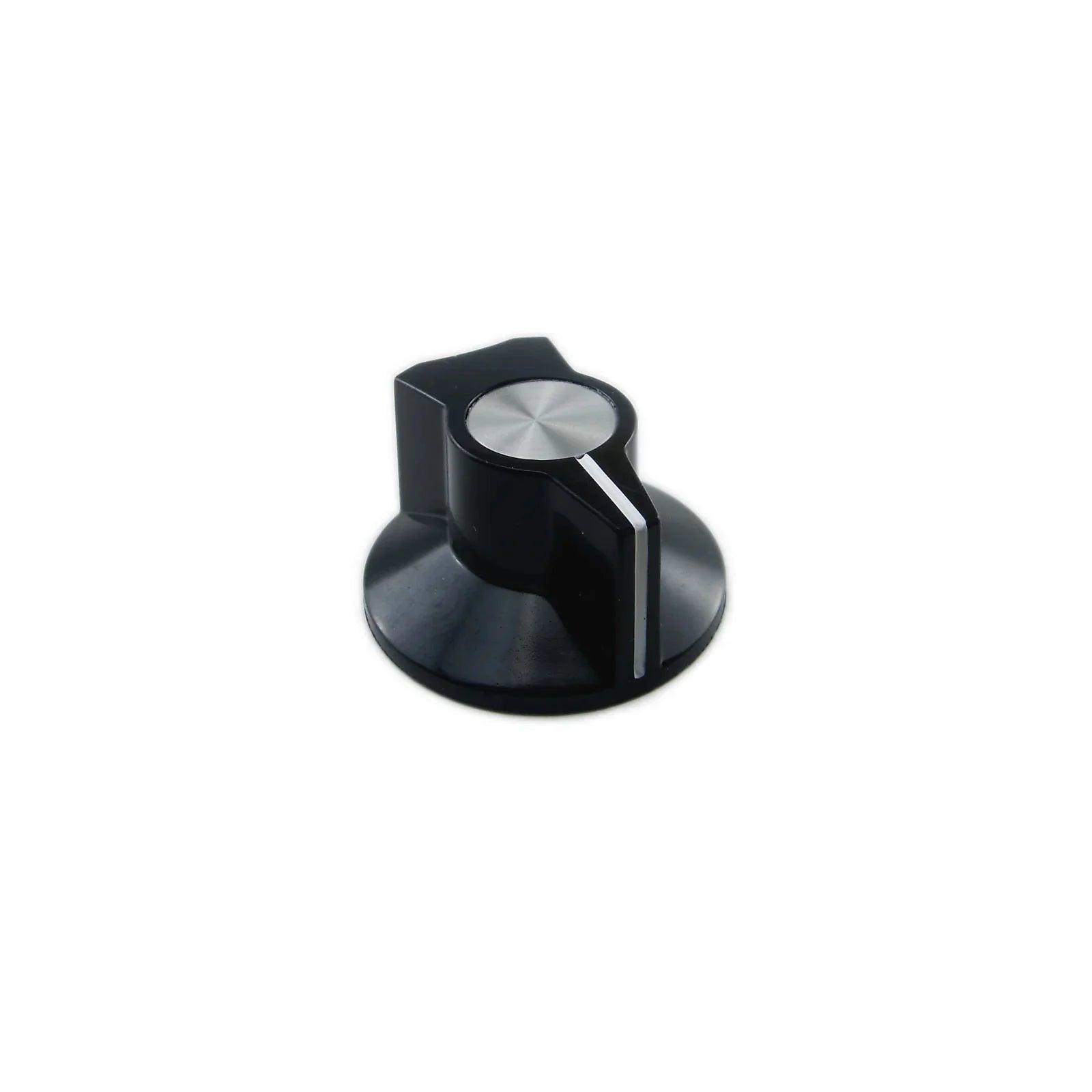 Black synthesizer knob with silver top and white indicator line on white background